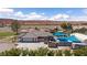 An aerial view of a luxurious home with a pool, covered patio, and scenic mountain views at 1988 N Moapa Valley Blvd, Logandale, NV 89021