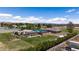 Aerial view of the estate featuring multiple structures, desert landscaping, and metal perimeter fencing at 1988 N Moapa Valley Blvd, Logandale, NV 89021