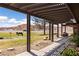 Covered patio with seating overlooks a spacious yard with horses grazing and scenic mountain views at 1988 N Moapa Valley Blvd, Logandale, NV 89021