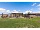 Expansive backyard view with grassy area and covered seating, great for outdoor entertaining at 1988 N Moapa Valley Blvd, Logandale, NV 89021