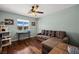 Cozy bedroom with wood floors, large sofa, and a cat tower for feline friends at 1988 N Moapa Valley Blvd, Logandale, NV 89021