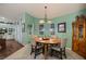Bright dining area features a round table and updated lighting fixtures at 1988 N Moapa Valley Blvd, Logandale, NV 89021