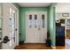 Charming entryway showcasing the front door and a glimpse of the bright, welcoming interior at 1988 N Moapa Valley Blvd, Logandale, NV 89021