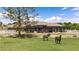 Home's exterior features brick accents, a pergola, and two horses grazing in the front yard at 1988 N Moapa Valley Blvd, Logandale, NV 89021