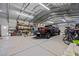 Large metal garage featuring vehicle, bicycles, and ample storage space at 1988 N Moapa Valley Blvd, Logandale, NV 89021