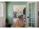 Inviting hallway with wood floors leading to a well-lit office space at 1988 N Moapa Valley Blvd, Logandale, NV 89021