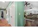 Bright hallway featuring hardwood floors and neutral walls, leading to a spacious living area at 1988 N Moapa Valley Blvd, Logandale, NV 89021
