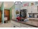 Modern kitchen with granite countertops, and stainless-steel appliances, enhancing culinary experience at 1988 N Moapa Valley Blvd, Logandale, NV 89021