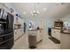 Modern kitchen with stainless steel fridge, sleek cabinetry, and island with seating at 1988 N Moapa Valley Blvd, Logandale, NV 89021