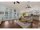 Open-concept living room with hardwood floors, connecting the living area to the kitchen at 1988 N Moapa Valley Blvd, Logandale, NV 89021