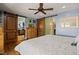Stylish bedroom with hardwood floors, sliding barn doors leading to ensuite, and bright, calm atmosphere at 1988 N Moapa Valley Blvd, Logandale, NV 89021
