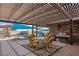 Covered outdoor patio with seating and barbecue, ideal for entertaining guests near the pool at 1988 N Moapa Valley Blvd, Logandale, NV 89021