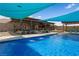 Inviting backyard pool with lush landscaping, water features, and shaded lounge areas at 1988 N Moapa Valley Blvd, Logandale, NV 89021
