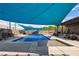 Inviting backyard pool and patio area with sunshade, perfect for relaxation at 1988 N Moapa Valley Blvd, Logandale, NV 89021