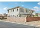 Two-story home showcasing a fenced yard, a covered patio, and tasteful stucco siding at 234 Priority Point St, Henderson, NV 89012