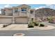 Charming two-story home with a two-car garage and well-maintained landscaping at 234 Priority Point St, Henderson, NV 89012
