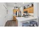 Bright kitchen featuring stainless steel appliances, wood cabinets, white countertops, and barstool seating at 234 Priority Point St, Henderson, NV 89012
