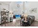 Bright living room features high ceilings, modern fireplace, and comfortable leather seating at 234 Priority Point St, Henderson, NV 89012
