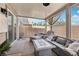 An inviting covered patio features comfortable seating, stylish decor, and a relaxing outdoor ambiance at 234 Priority Point St, Henderson, NV 89012