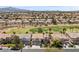 Overview of the neighborhood with golf course and well-maintained lawns and landscaping at 2445 Ping Dr, Henderson, NV 89074