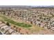 Aerial view of a residential neighborhood bordering a golf course, showcasing community layout at 2445 Ping Dr, Henderson, NV 89074