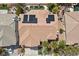 Bird's eye view of a house with solar panels, lush landscaping, and backyard pool at 2445 Ping Dr, Henderson, NV 89074