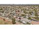 Extensive aerial view of homes interspersed with lush greenery and a golf course at 2445 Ping Dr, Henderson, NV 89074