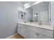 Bathroom featuring double sinks and ample cabinet space at 2445 Ping Dr, Henderson, NV 89074