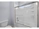 Clean, well-lit bathroom with a shower-tub combination and built-in shelving at 2445 Ping Dr, Henderson, NV 89074