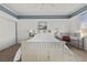 Bedroom featuring a white bed, blue accent, and a ceiling fan at 2445 Ping Dr, Henderson, NV 89074