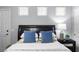 Cozy bedroom with plush pillows, bedside table, and ample natural light at 2445 Ping Dr, Henderson, NV 89074