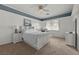 Bedroom with white bed, blue accent, and carpet flooring at 2445 Ping Dr, Henderson, NV 89074