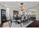 Formal dining room with coffered ceiling, wine cabinet and backyard view at 2445 Ping Dr, Henderson, NV 89074