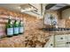 Close up of the kitchen with tile backsplash and gas stovetop at 2445 Ping Dr, Henderson, NV 89074
