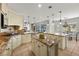 Open kitchen featuring granite countertops, tile floors, and modern appliances at 2445 Ping Dr, Henderson, NV 89074