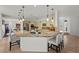 Spacious kitchen with stainless steel appliances, granite counters, and pendant lights at 2445 Ping Dr, Henderson, NV 89074