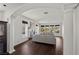 Open living room with hardwood floors, fireplace, and elegant columns at 2445 Ping Dr, Henderson, NV 89074