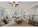 Open living room with kitchen bar seating and bright lighting at 2445 Ping Dr, Henderson, NV 89074