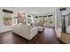 Bright living room boasts hardwood floors, fireplace, and multiple windows at 2445 Ping Dr, Henderson, NV 89074