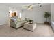 Bright living room with neutral carpet, comfortable seating, and an open floor plan at 2445 Ping Dr, Henderson, NV 89074