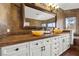 The bathroom vanity features double sinks and white cabinets at 2445 Ping Dr, Henderson, NV 89074