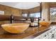 Bathroom vanity featuring stone bowl sinks and unique faucets at 2445 Ping Dr, Henderson, NV 89074