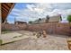 Spacious backyard with a fire pit and wooden stump seating at 3939 Jontue St, Las Vegas, NV 89115