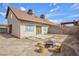 Spacious backyard with a fire pit and wooden stump seating at 3939 Jontue St, Las Vegas, NV 89115