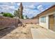 Spacious backyard with a fire pit and wooden stump seating at 3939 Jontue St, Las Vegas, NV 89115