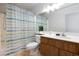 Bathroom featuring modern vanity, shower-tub combo, and updated fixtures at 3939 Jontue St, Las Vegas, NV 89115