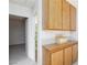 Hallway cabinet features wooden doors with cabinet and shelf space for linen storage at 3939 Jontue St, Las Vegas, NV 89115
