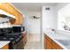 Kitchen with view to staircase and breakfast bar at 3939 Jontue St, Las Vegas, NV 89115