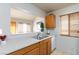 Kitchen featuring stainless steel sink, tile flooring, and breakfast bar at 3939 Jontue St, Las Vegas, NV 89115