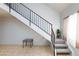 Staircase featuring metal railing, wood banister, and carpeted steps at 3939 Jontue St, Las Vegas, NV 89115